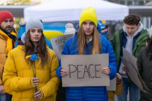 Protest against Russian invasion of Ukraine. People holding anti war sings and banners in street